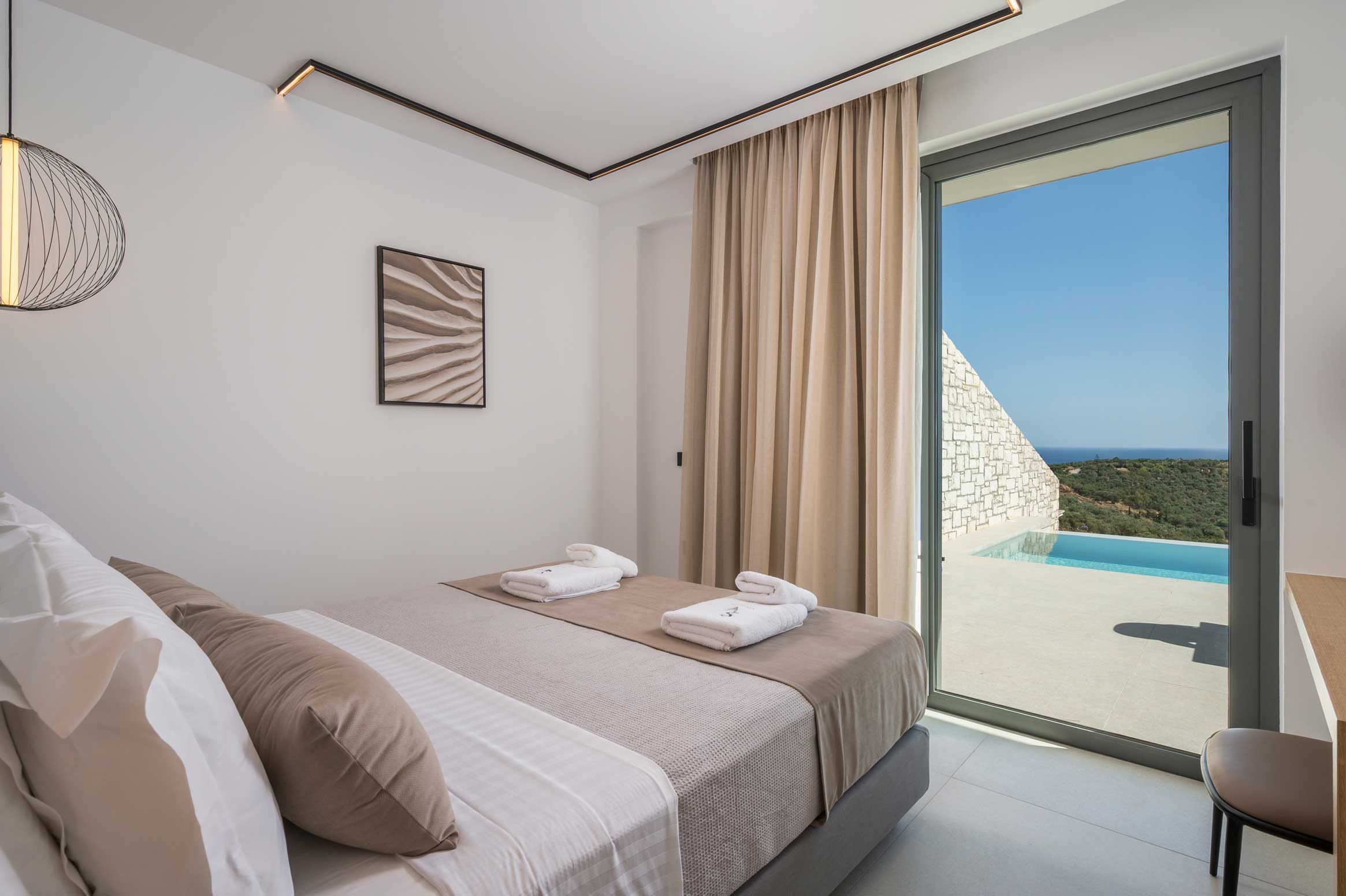 a bedroom with a large window