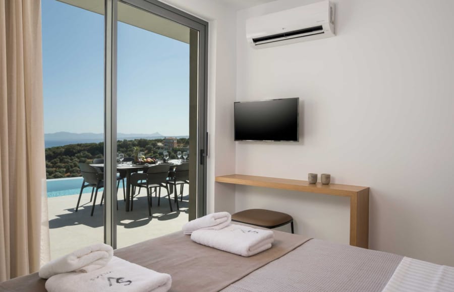 a bedroom with a large window