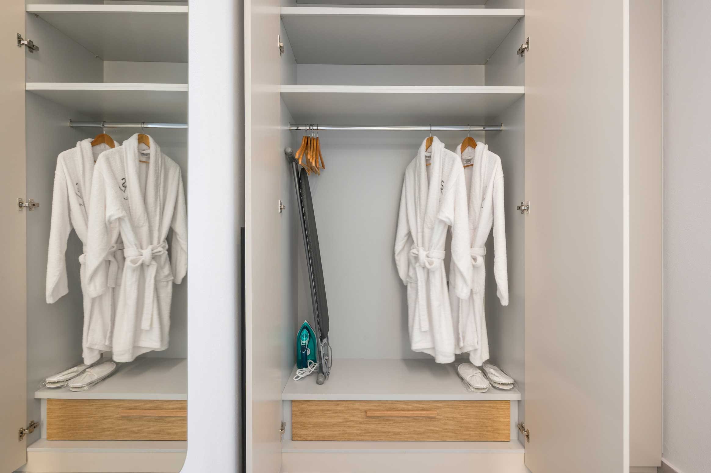 a closet with clothes