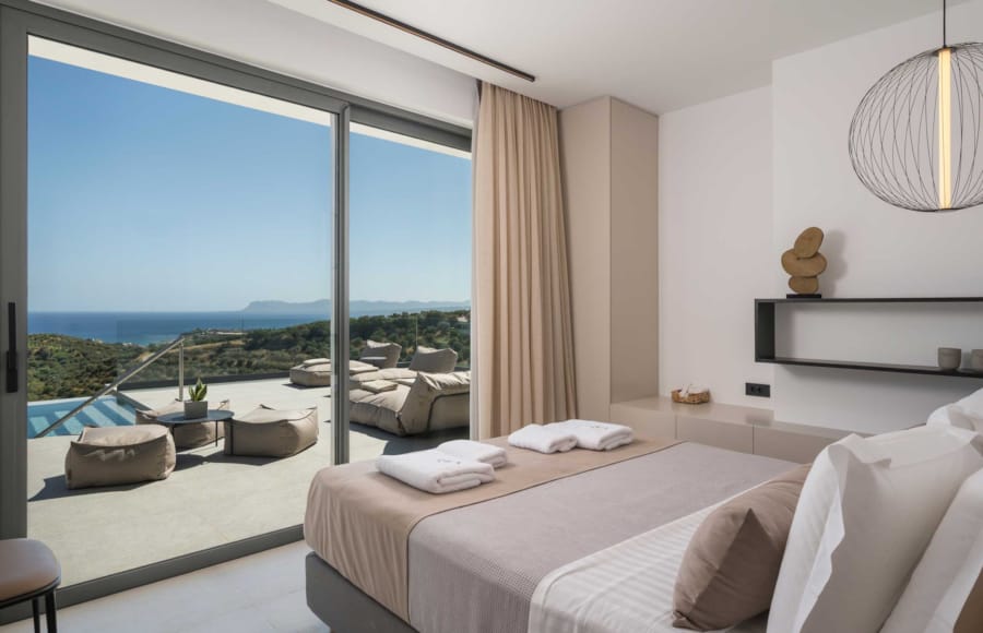 a bedroom with a large window