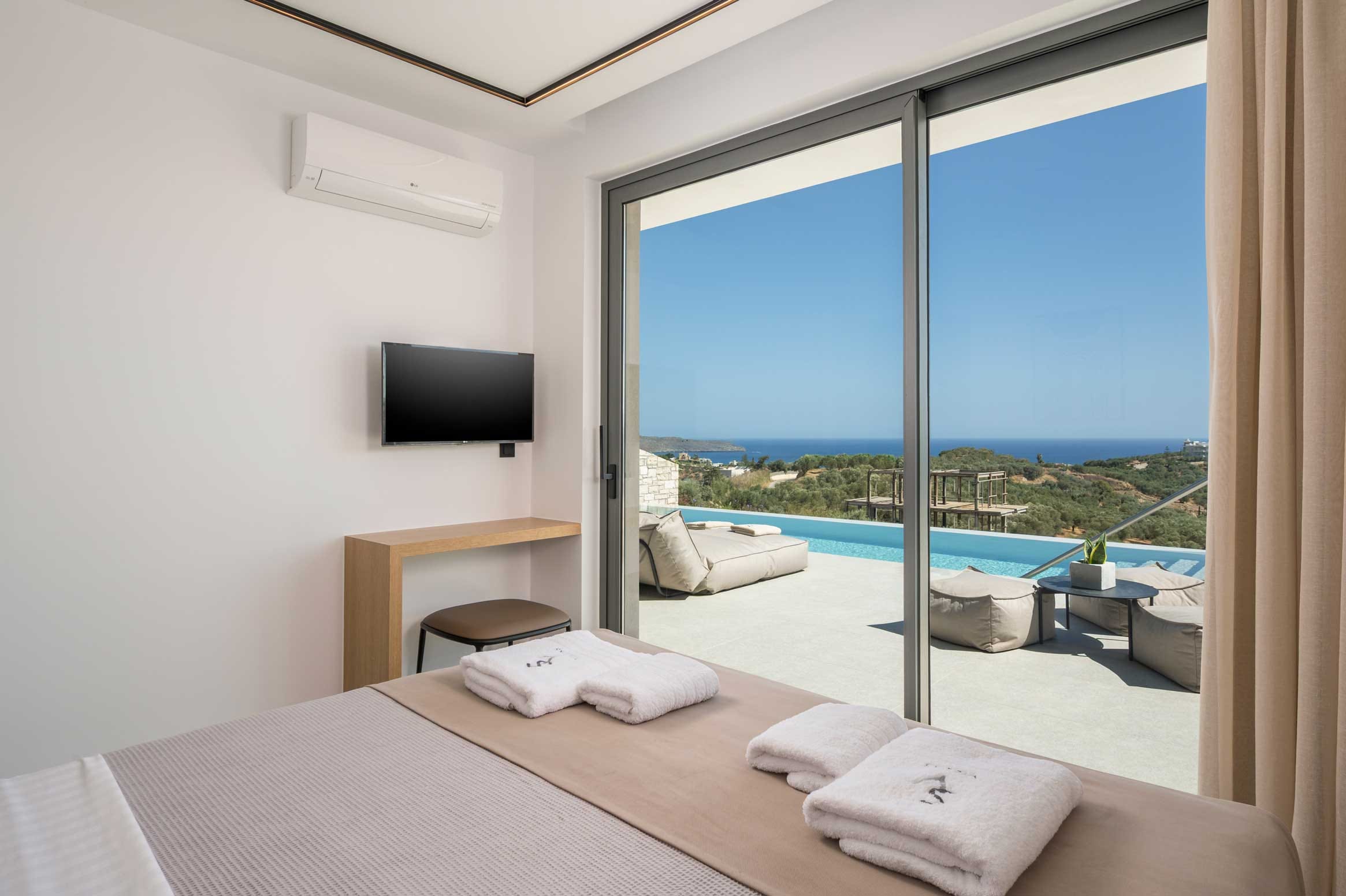 a bed with a view of the ocean