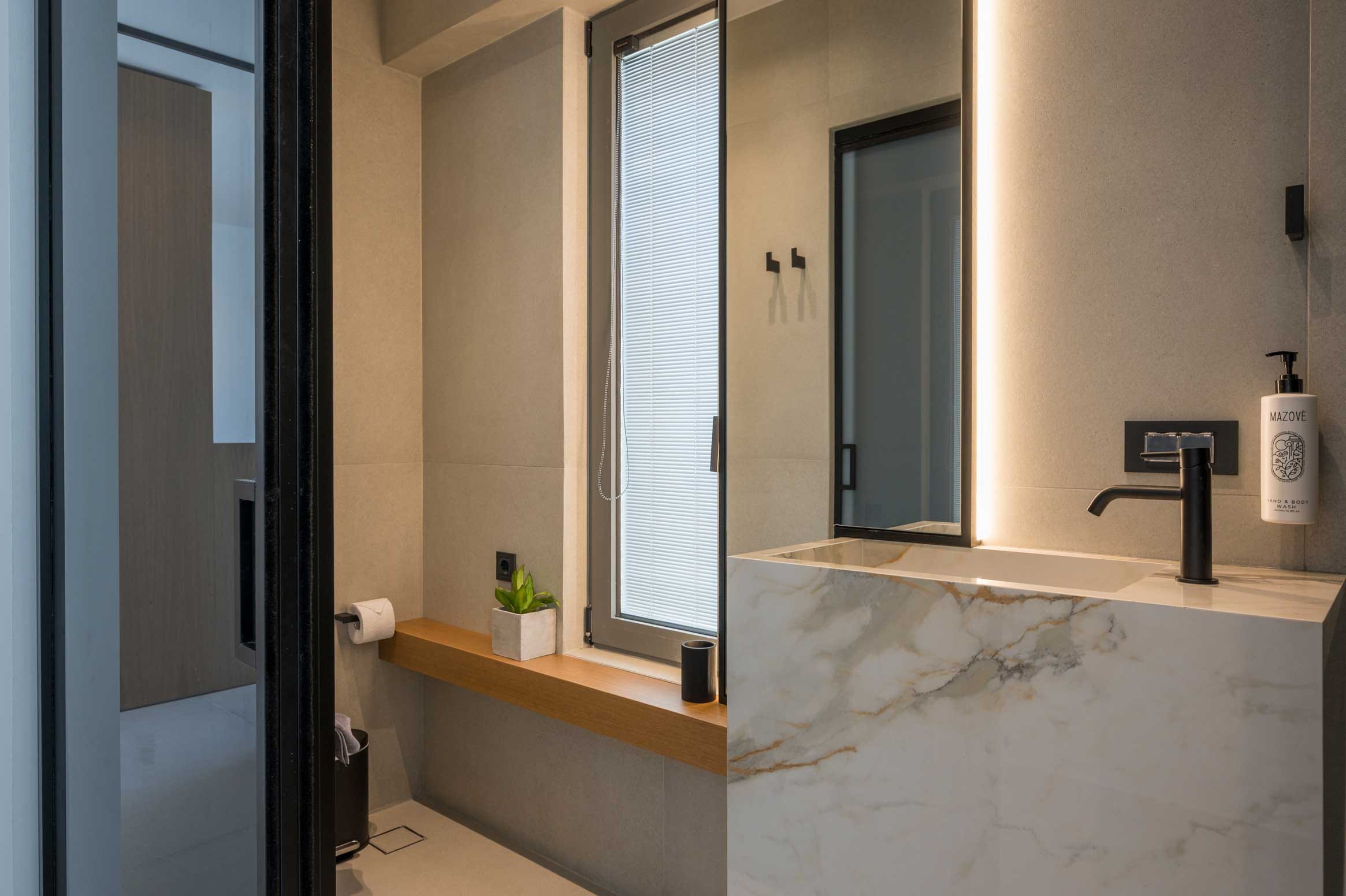 a bathroom with a bathtub and a sink