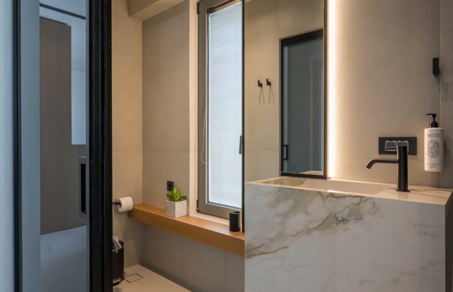 a bathroom with a bathtub and a sink