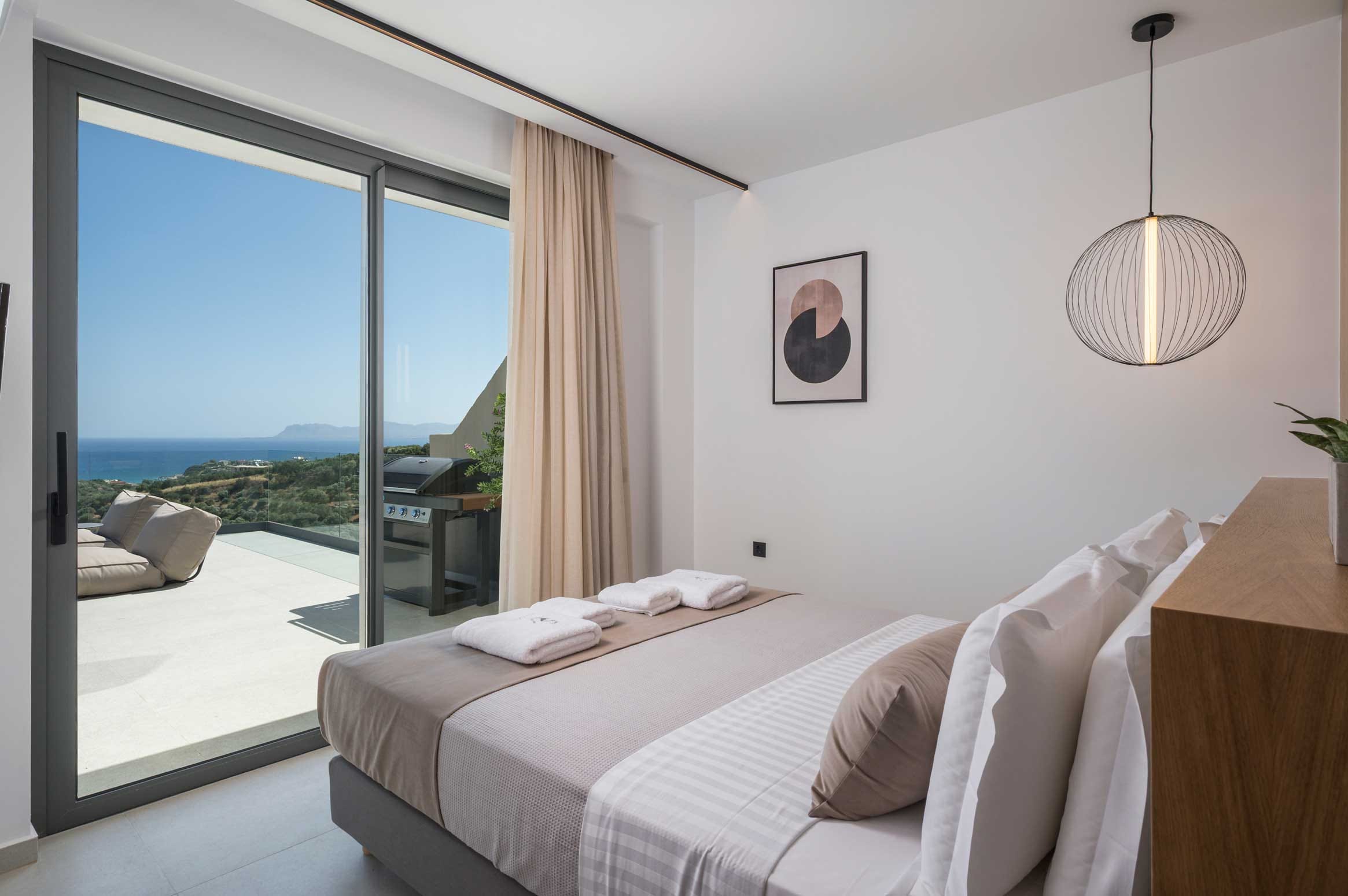 a bedroom with a large window