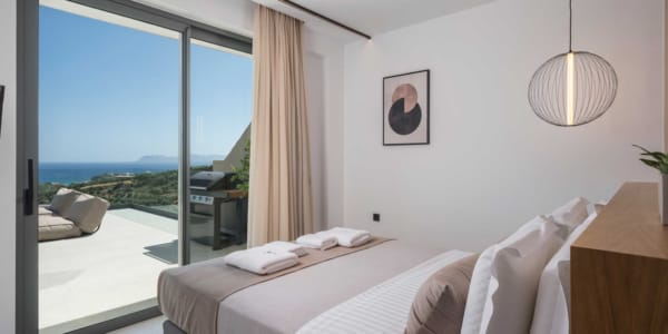 a bedroom with a large window