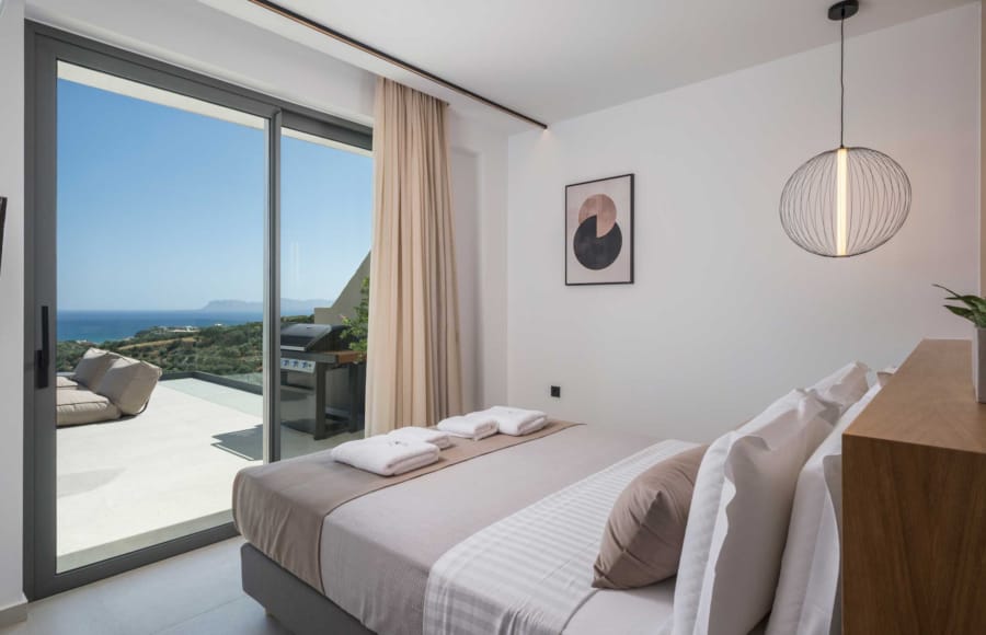 a bedroom with a large window