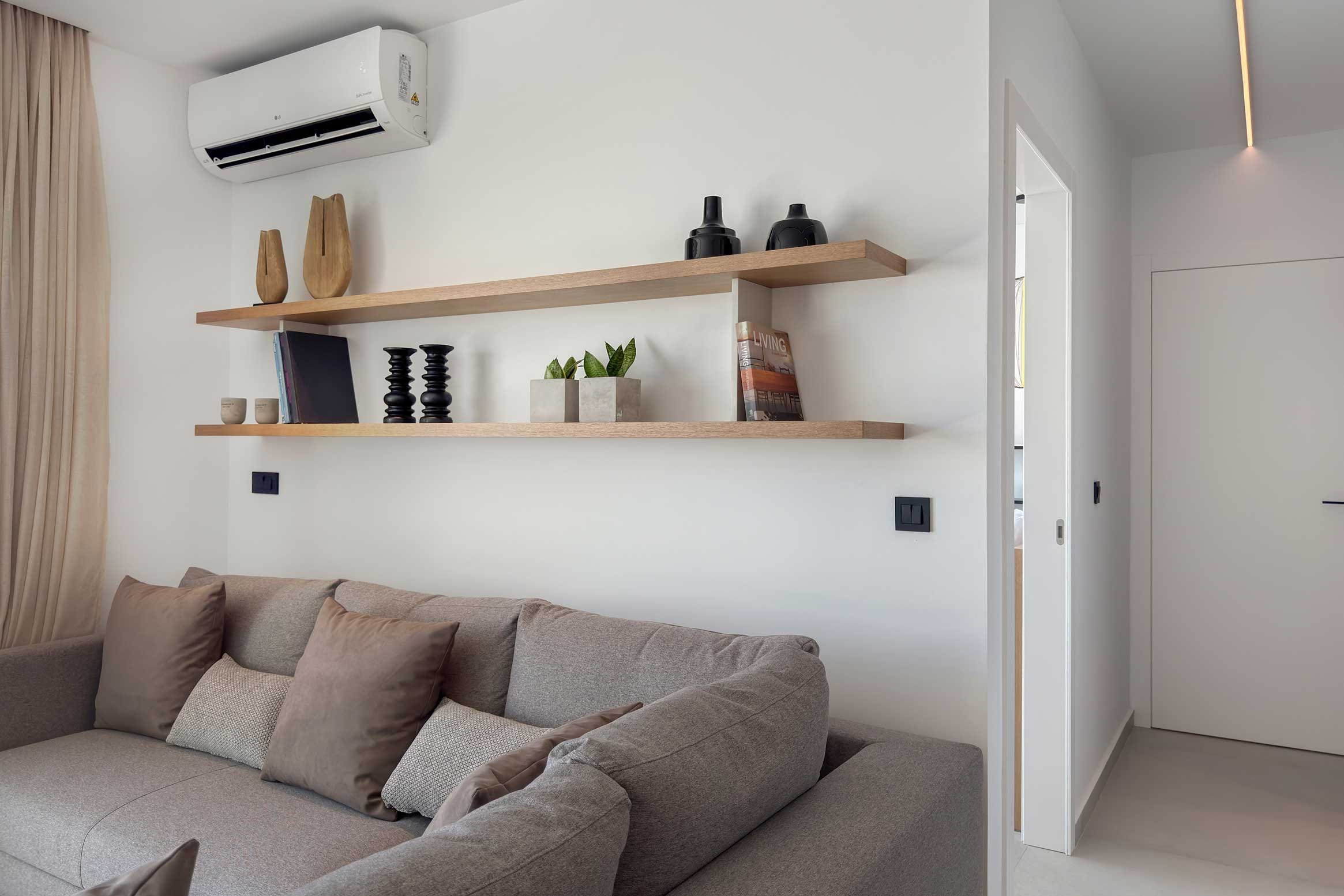 a living room with a white wall