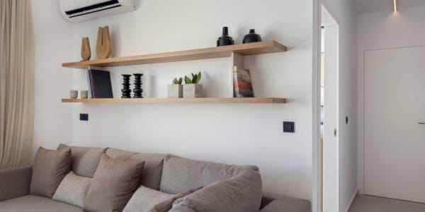 a living room with a white wall