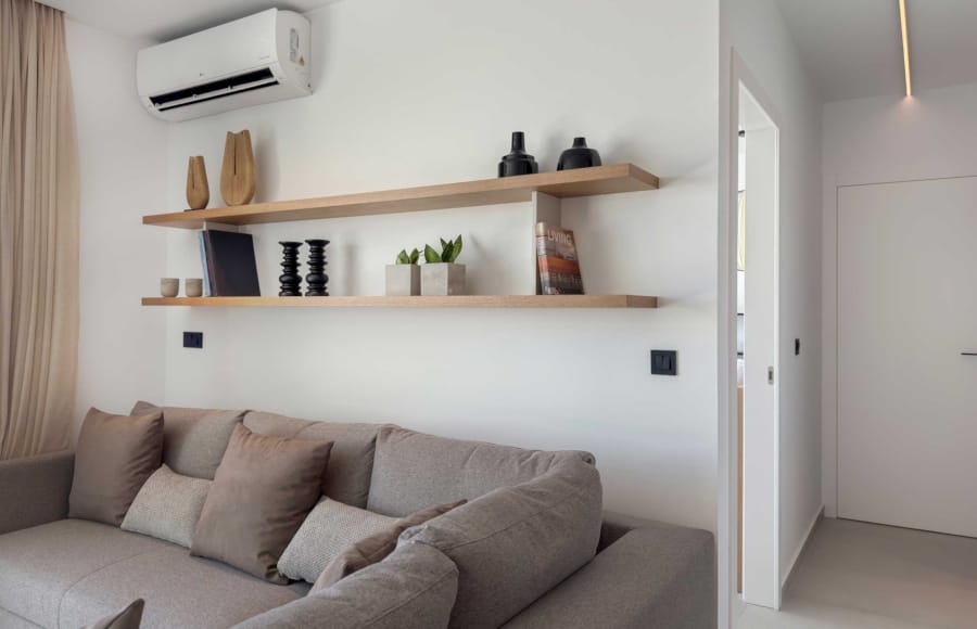 a living room with a white wall