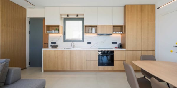 a large kitchen with a tv and a couch