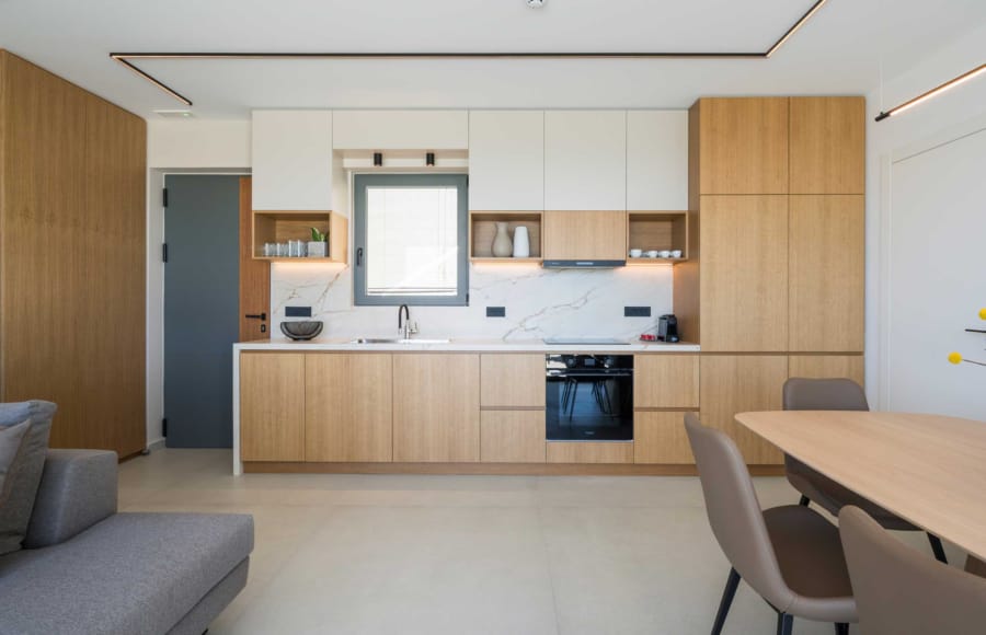 a large kitchen with a tv and a couch