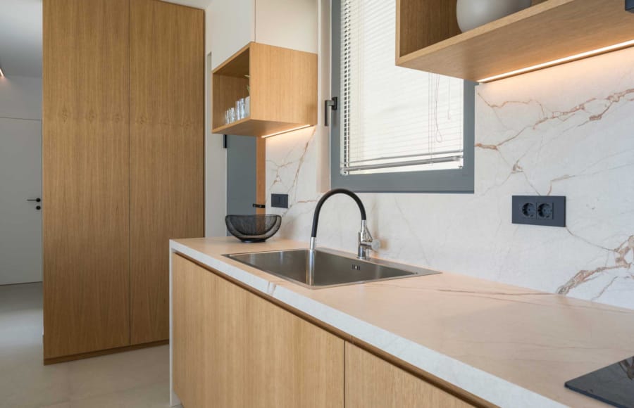a kitchen with a sink and cabinets