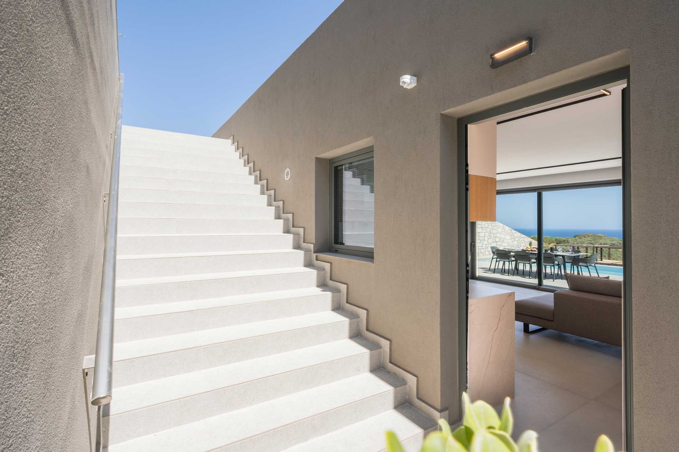 a white staircase leading to a building