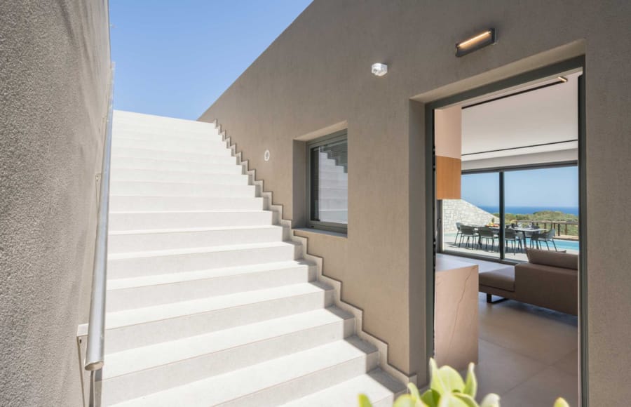 a white staircase leading to a building