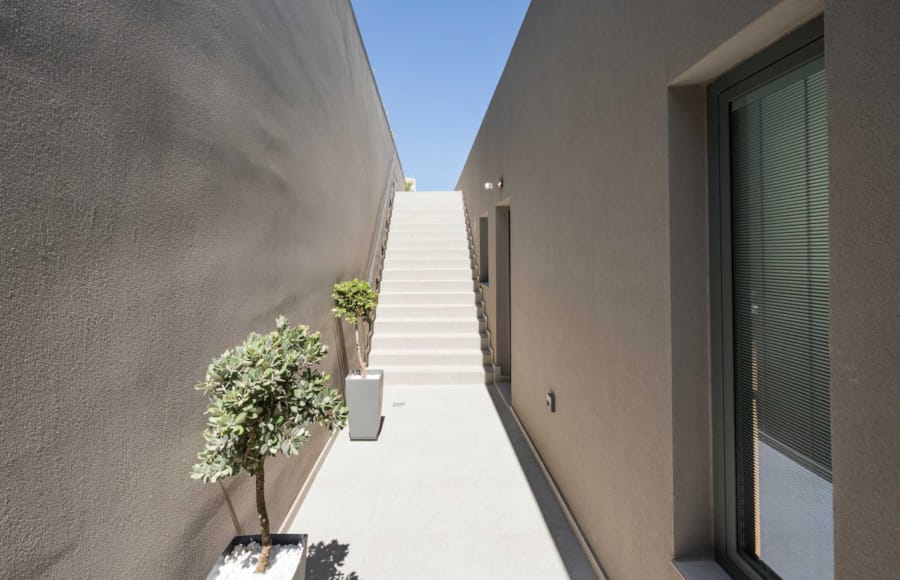 a hallway with potted plants