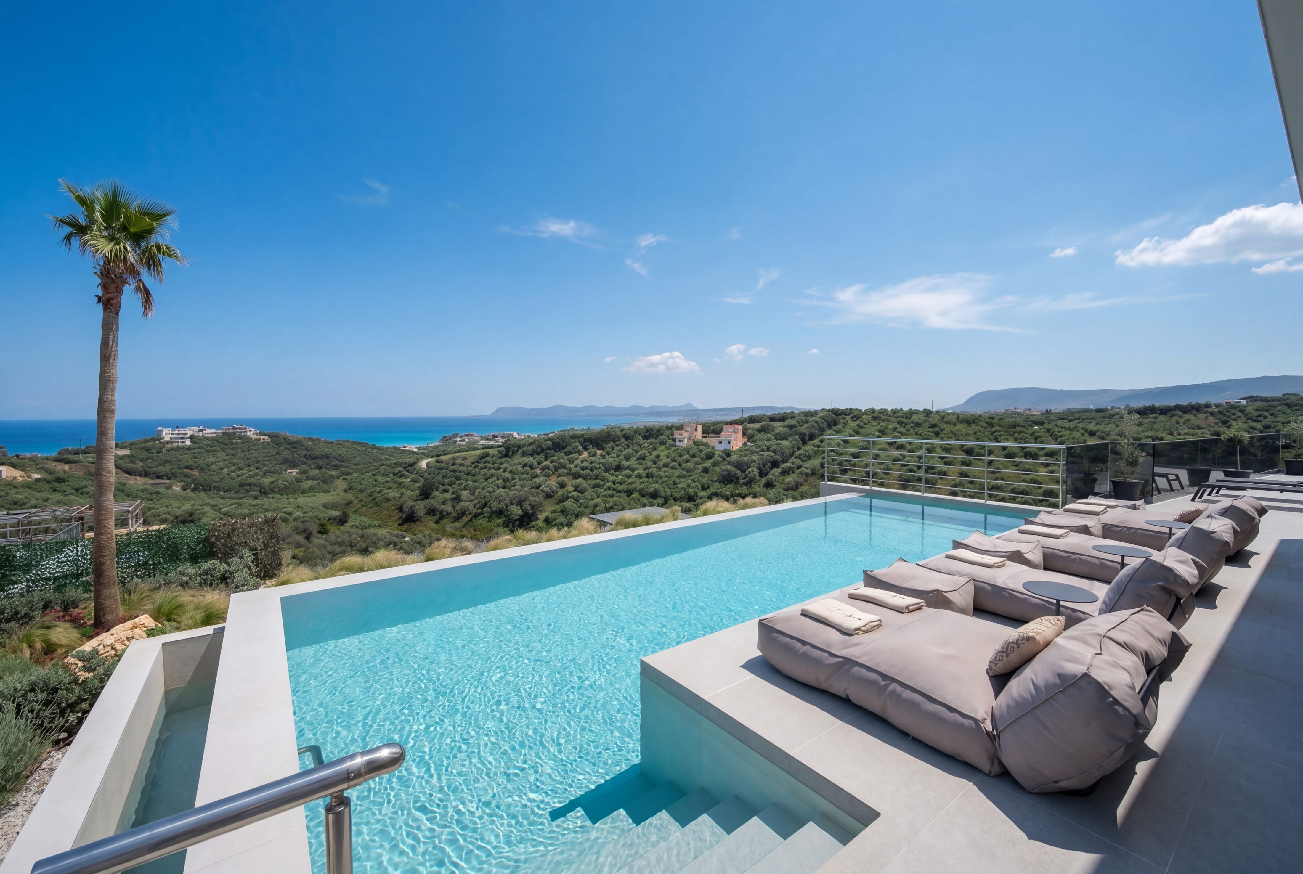 a pool with a deck and couches