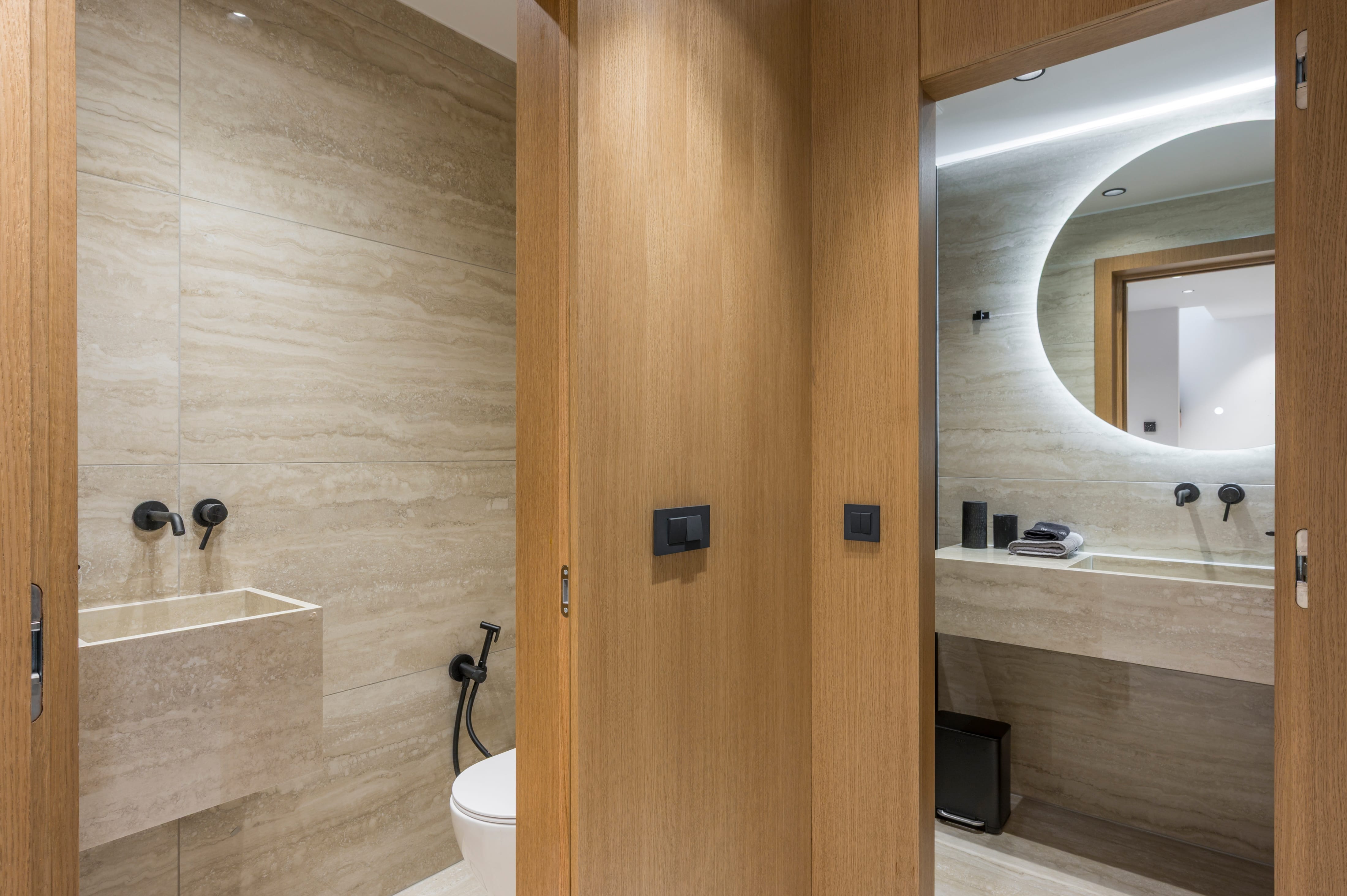a bathroom with a door open