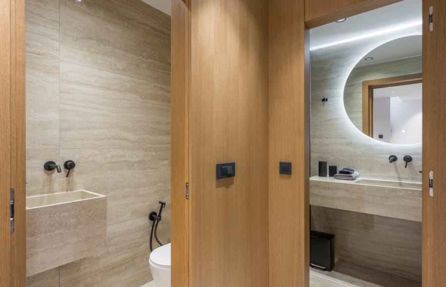 a bathroom with a door open