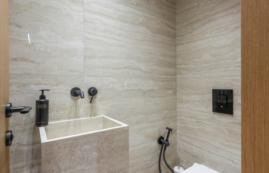 a bathroom with a sink and faucet