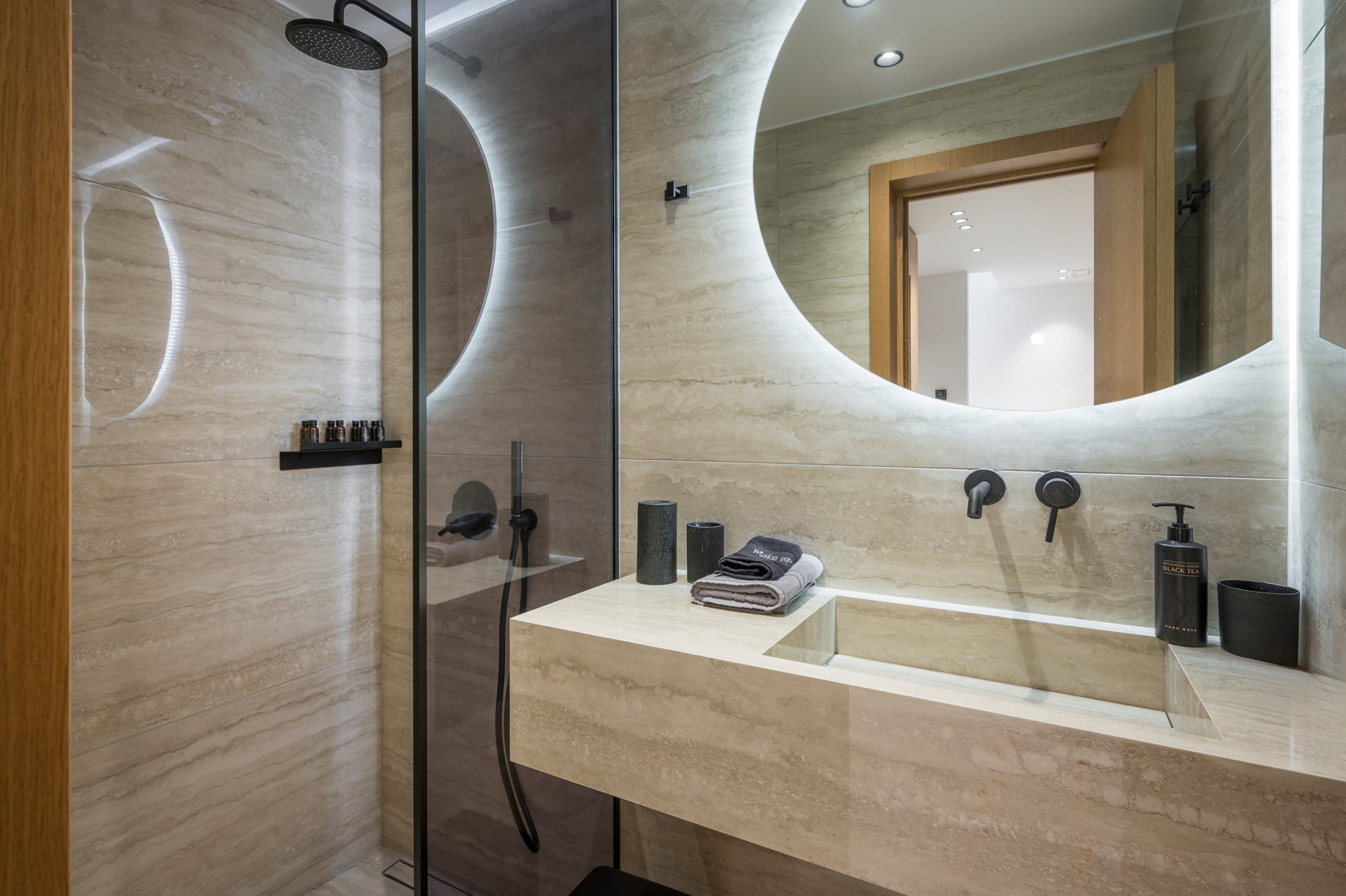 a bathroom with a round mirror