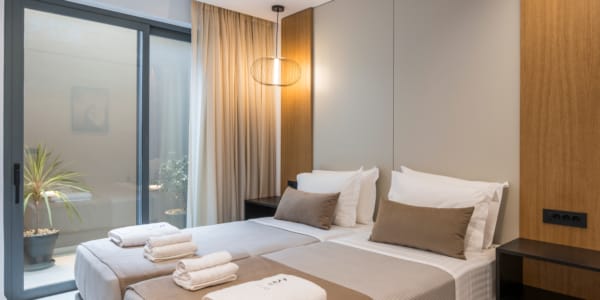 a bed with two beds in a room