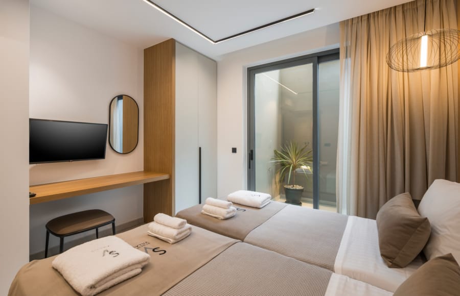 a room with a bed and a tv