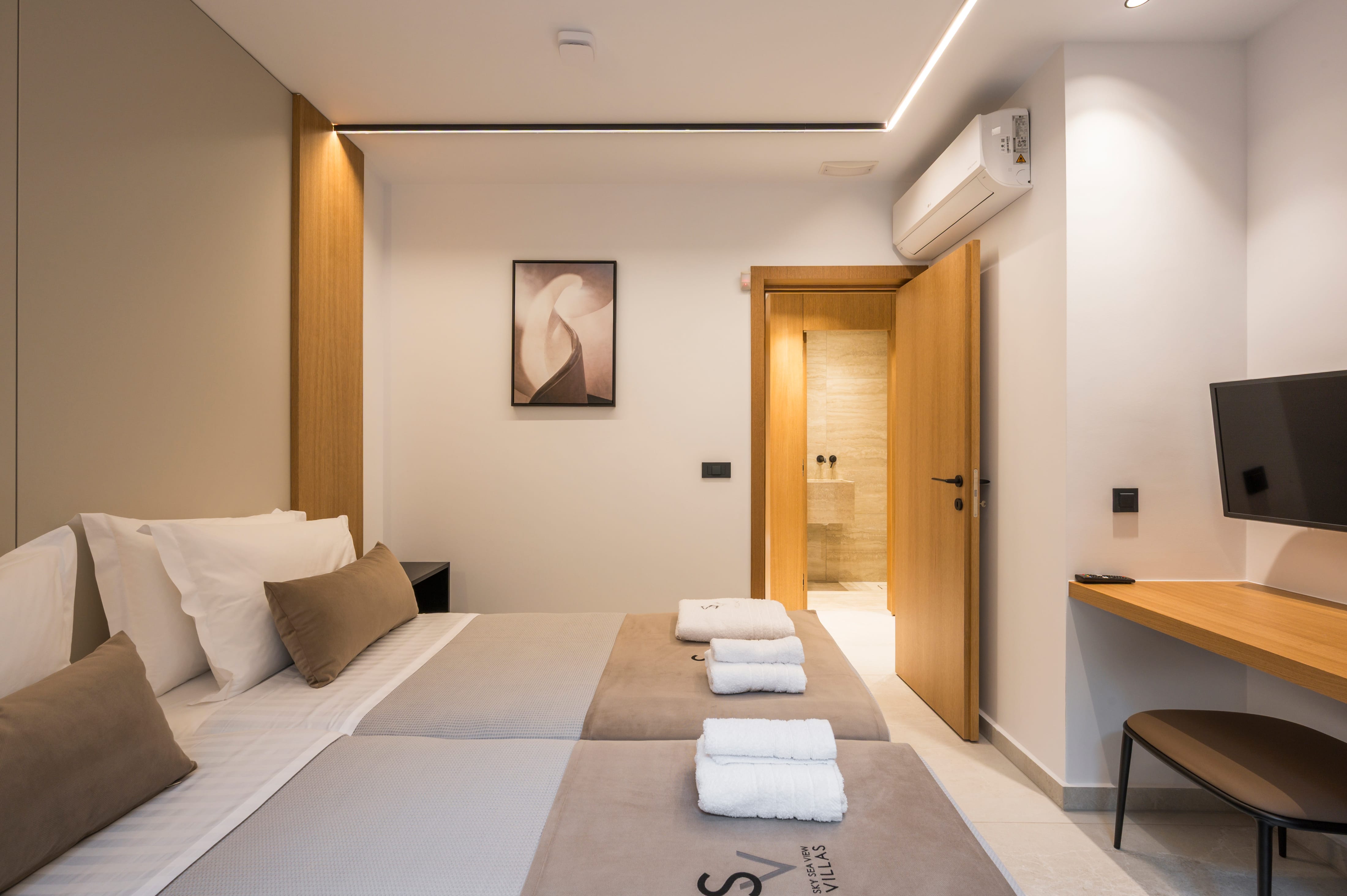 a room with two beds and a door