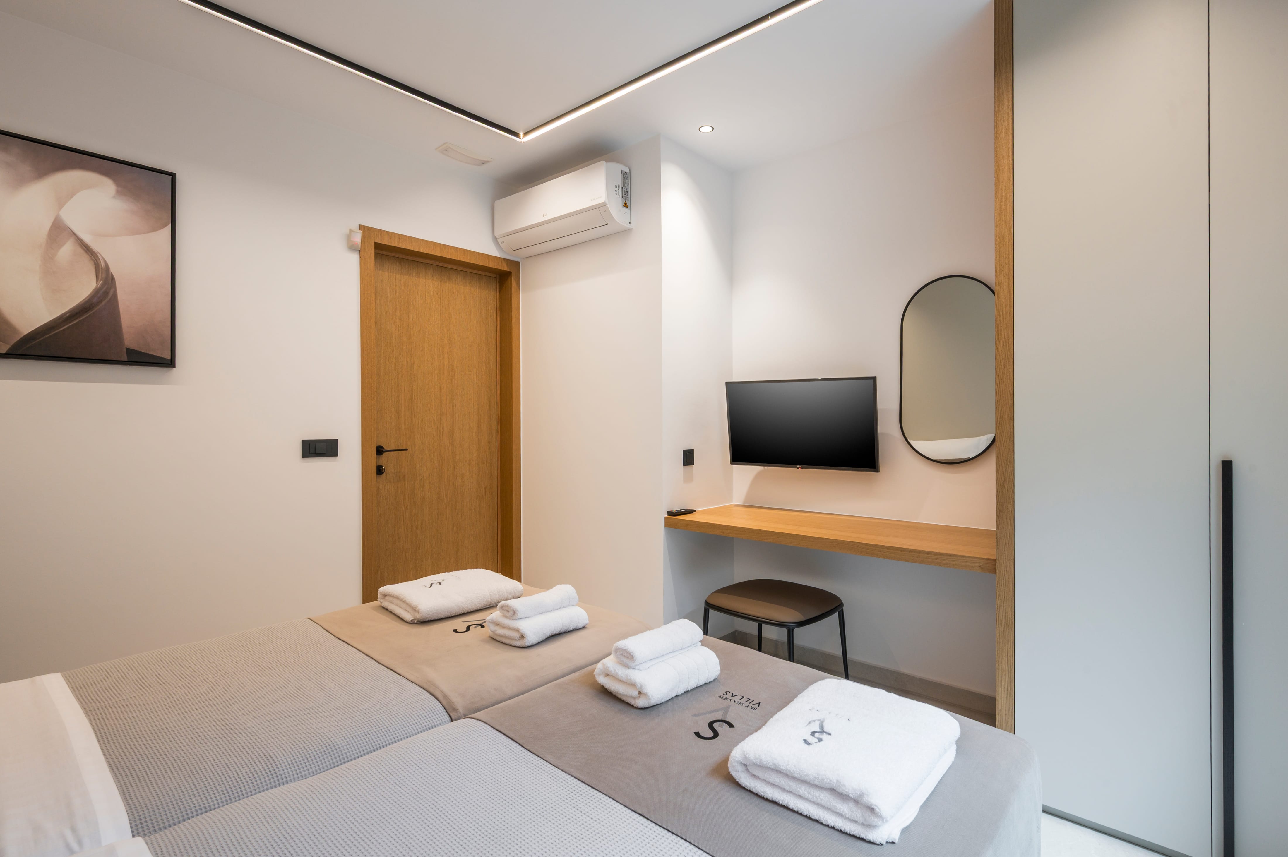 a room with a television and a bed