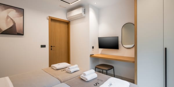 a room with a television and a bed