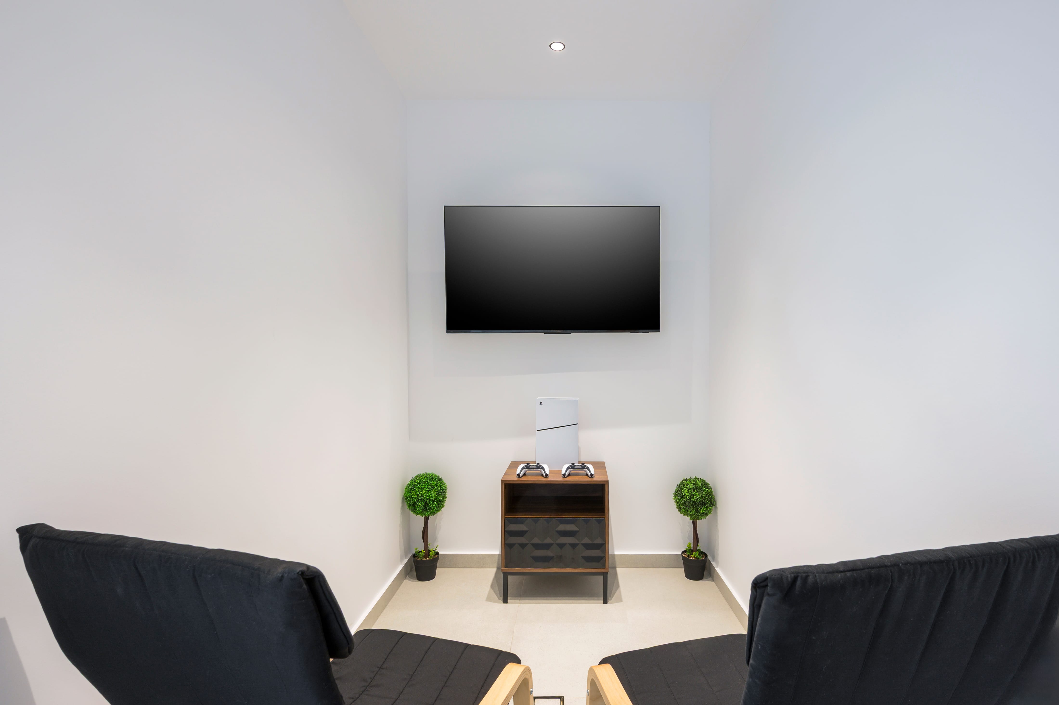 a room with a tv on the wall
