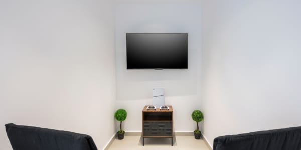 a room with a tv on the wall