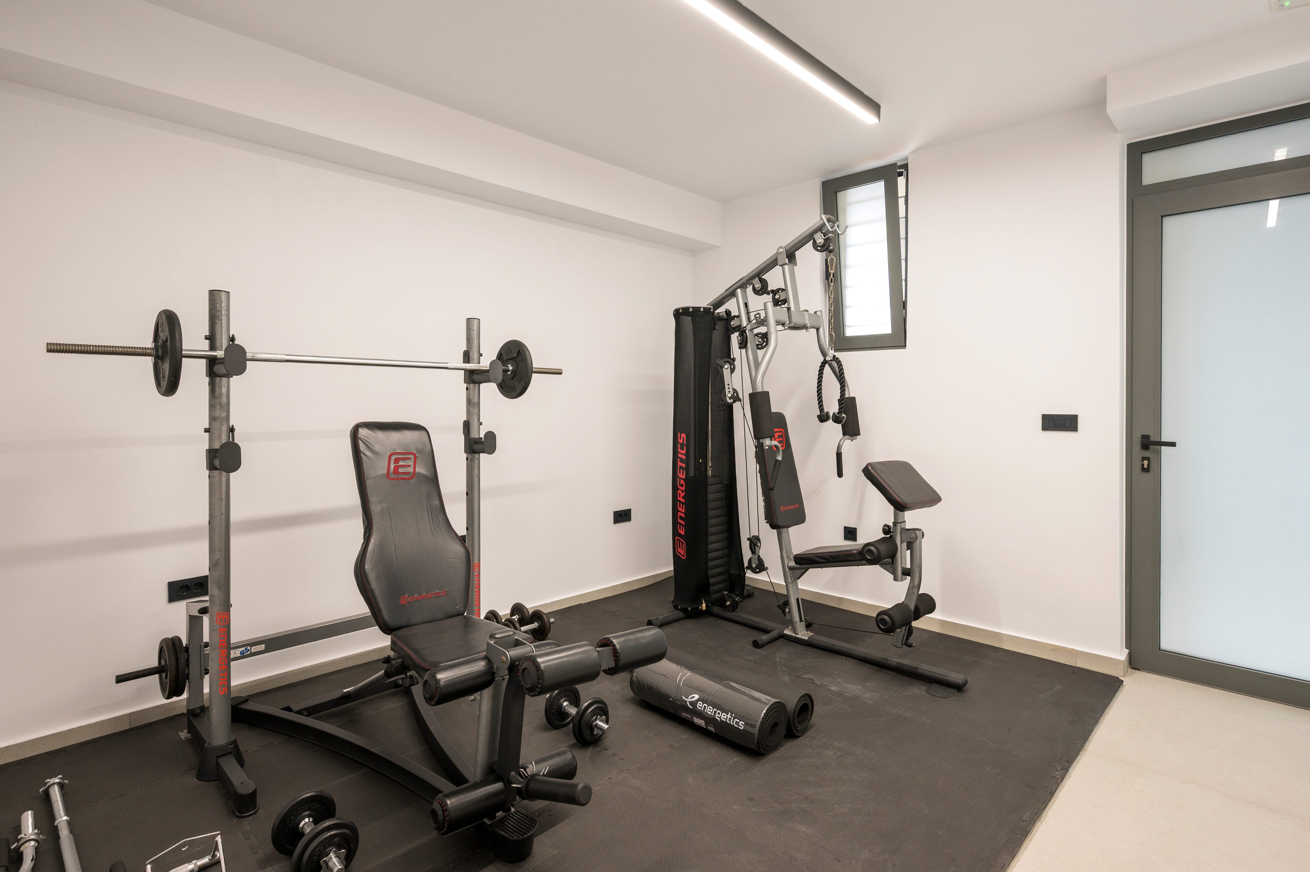 a gym with weights and exercise equipment