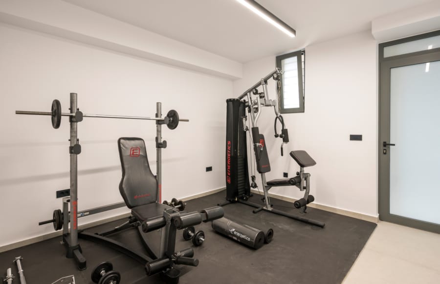 a gym with weights and exercise equipment