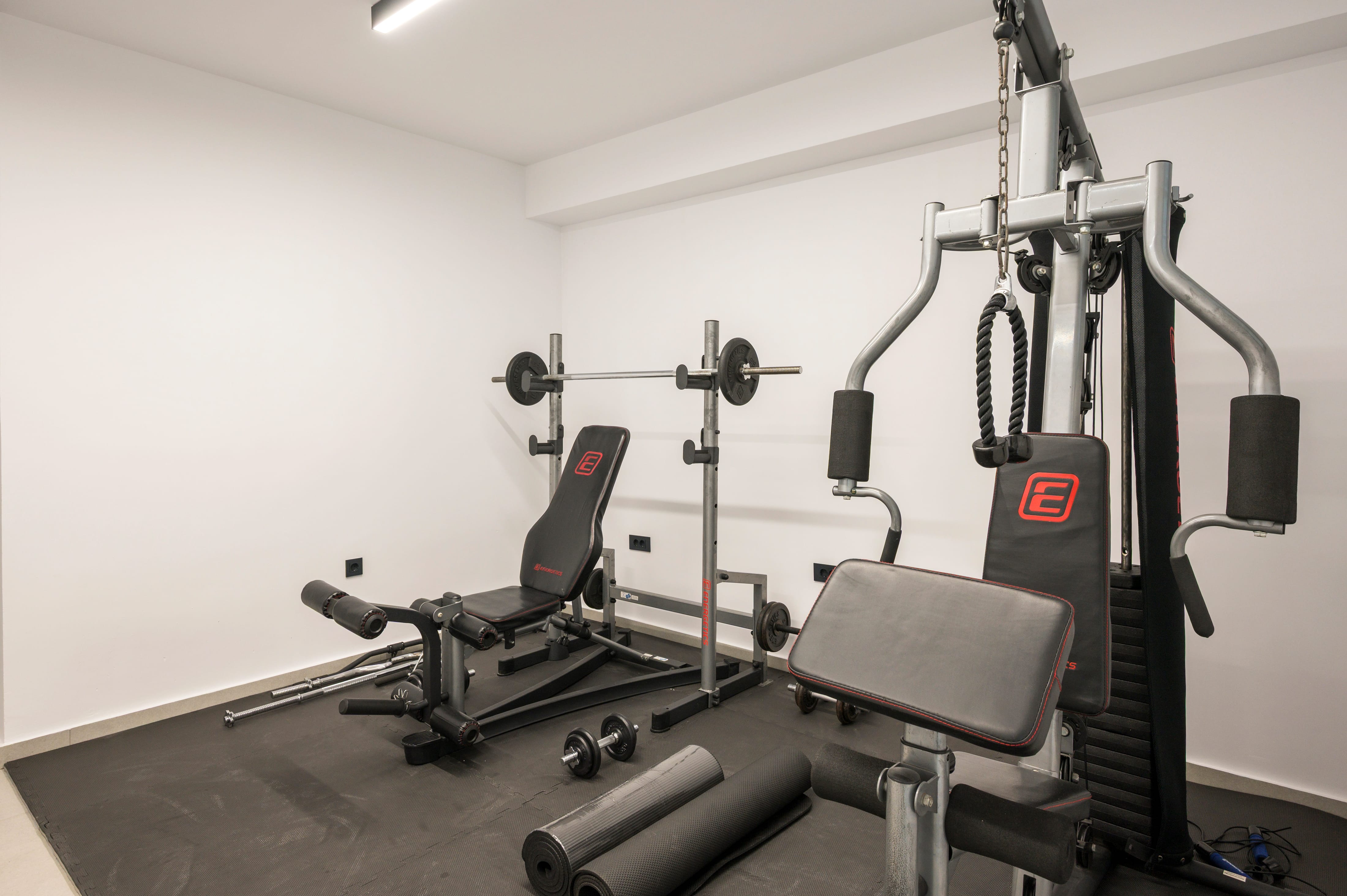 a gym with weights and exercise equipment
