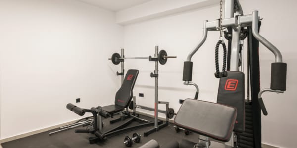 a gym with weights and exercise equipment