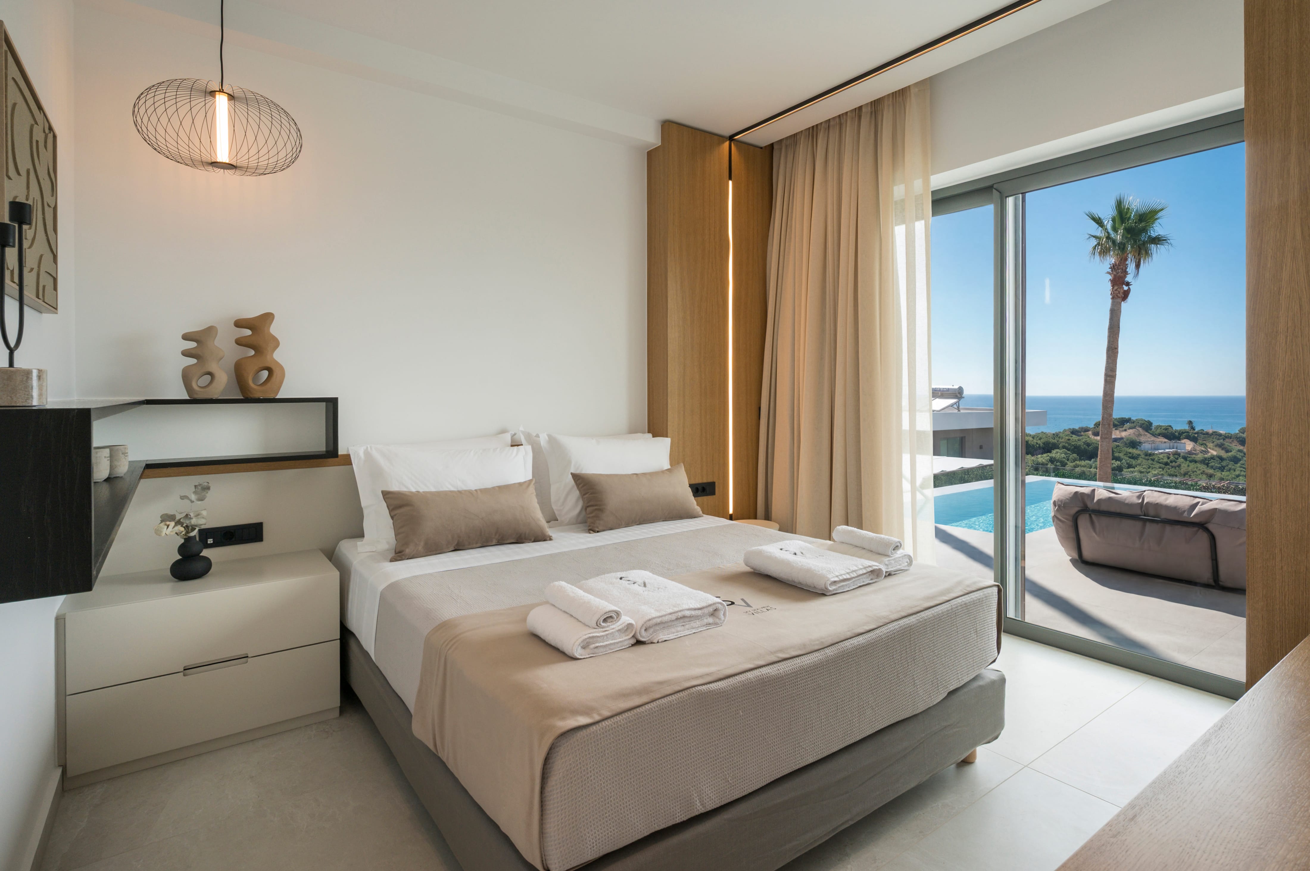 a bedroom with a pool and a bed