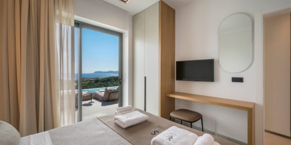 a bedroom with a large window
