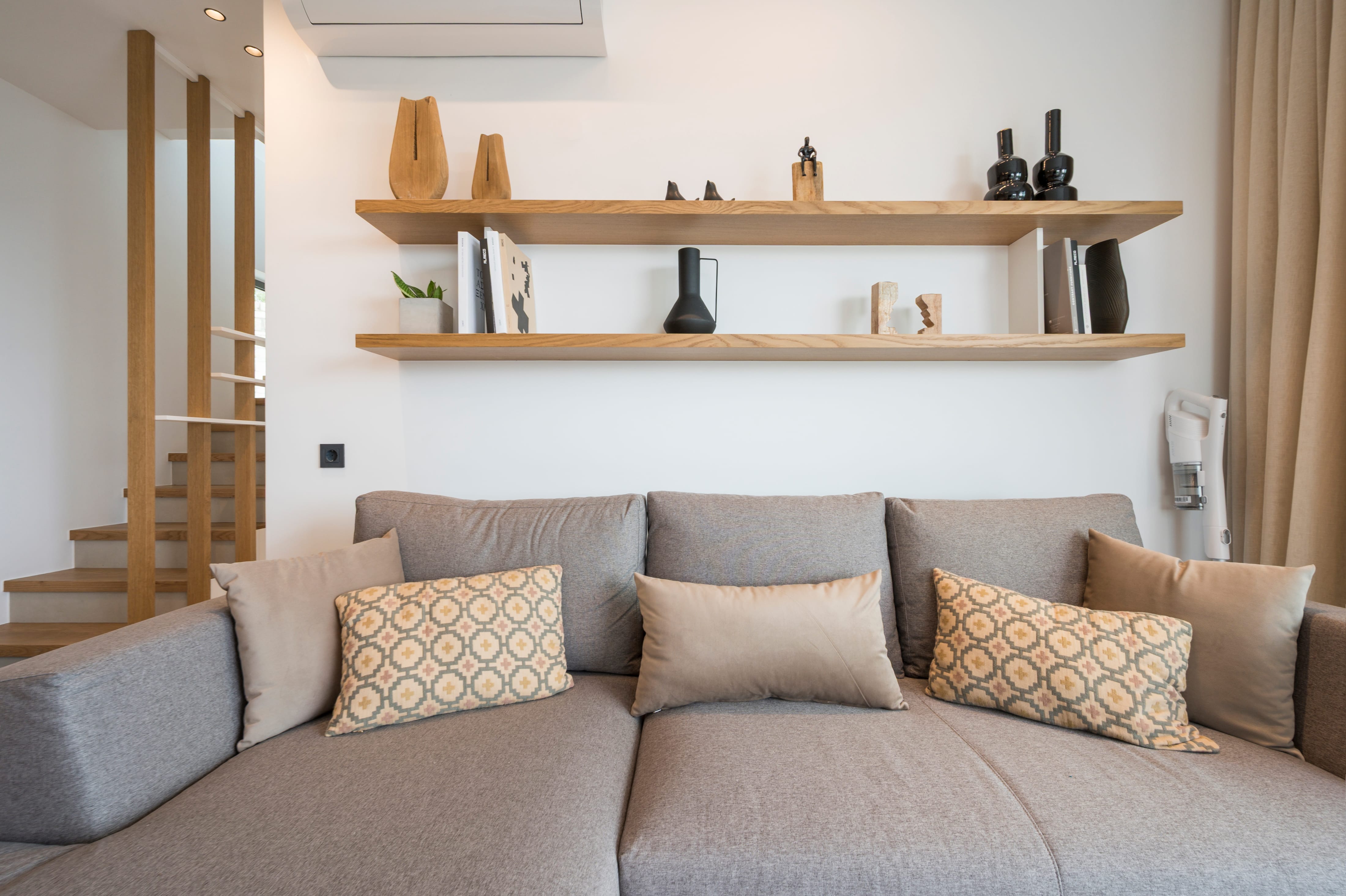 a couch with pillows in a room