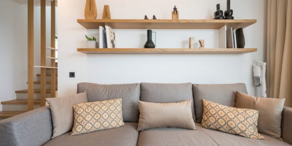 a couch with pillows in a room