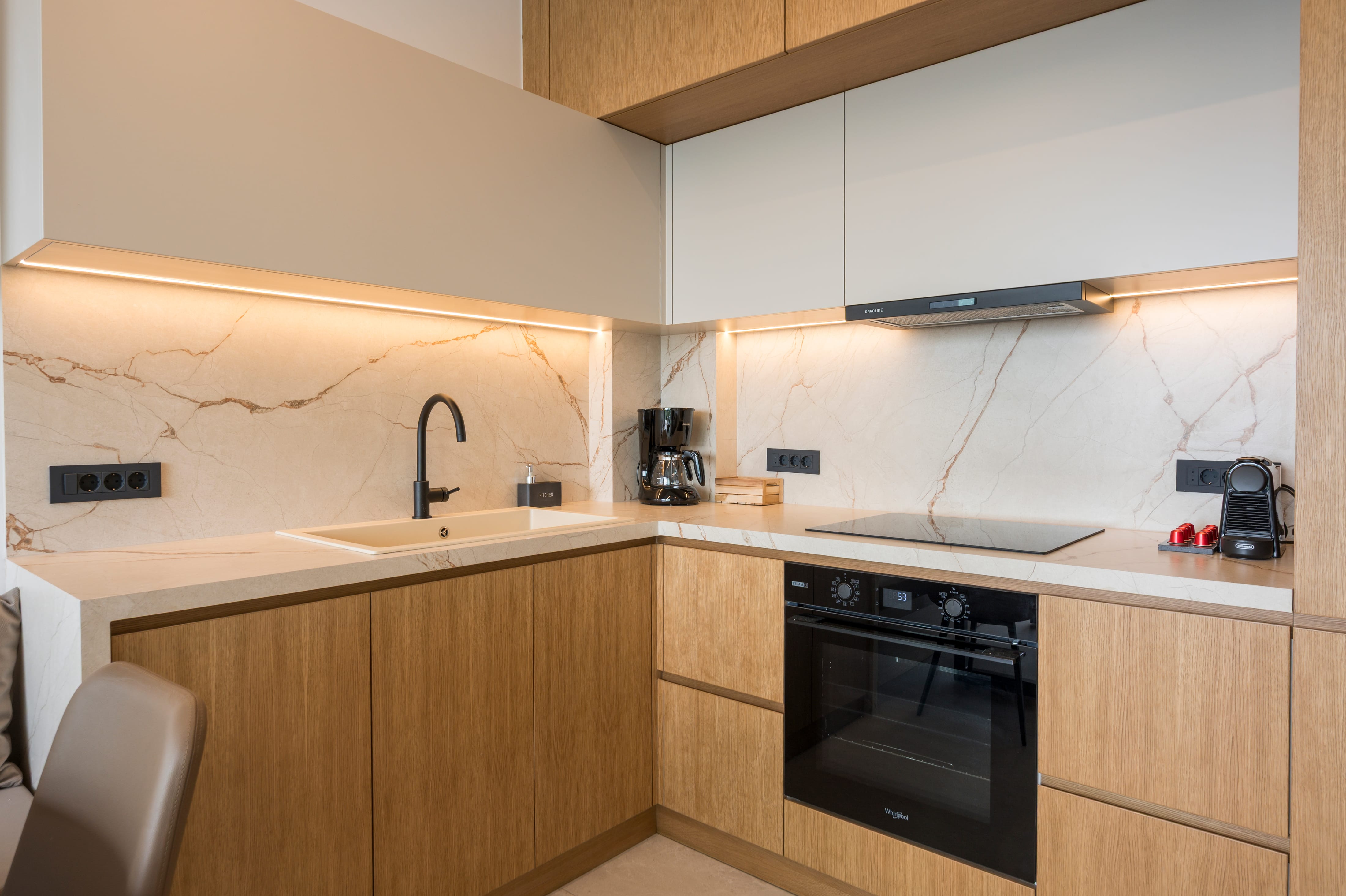 a kitchen with a sink and stove