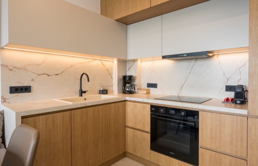 a kitchen with a sink and stove