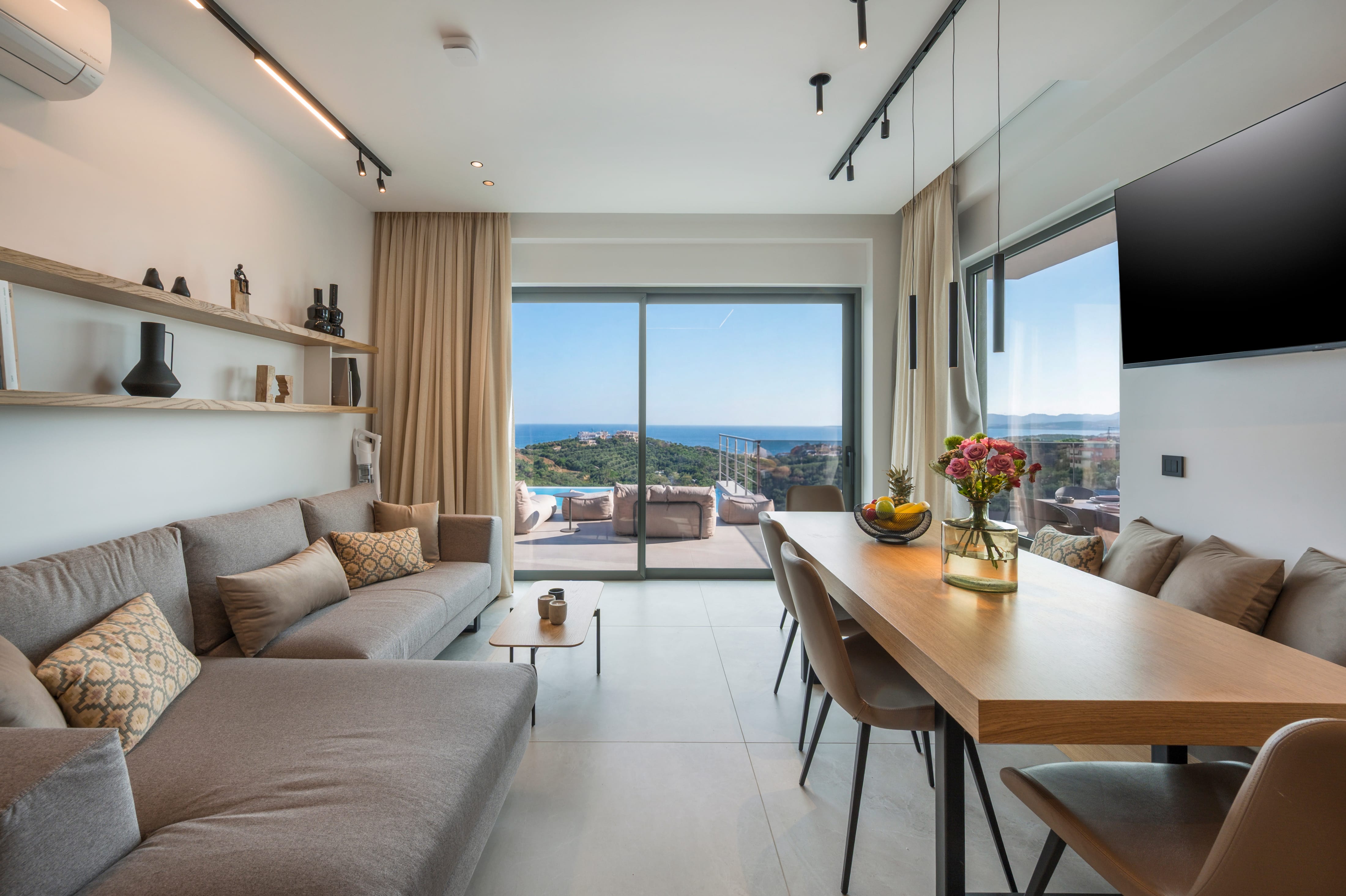 a living room with a table and chairs