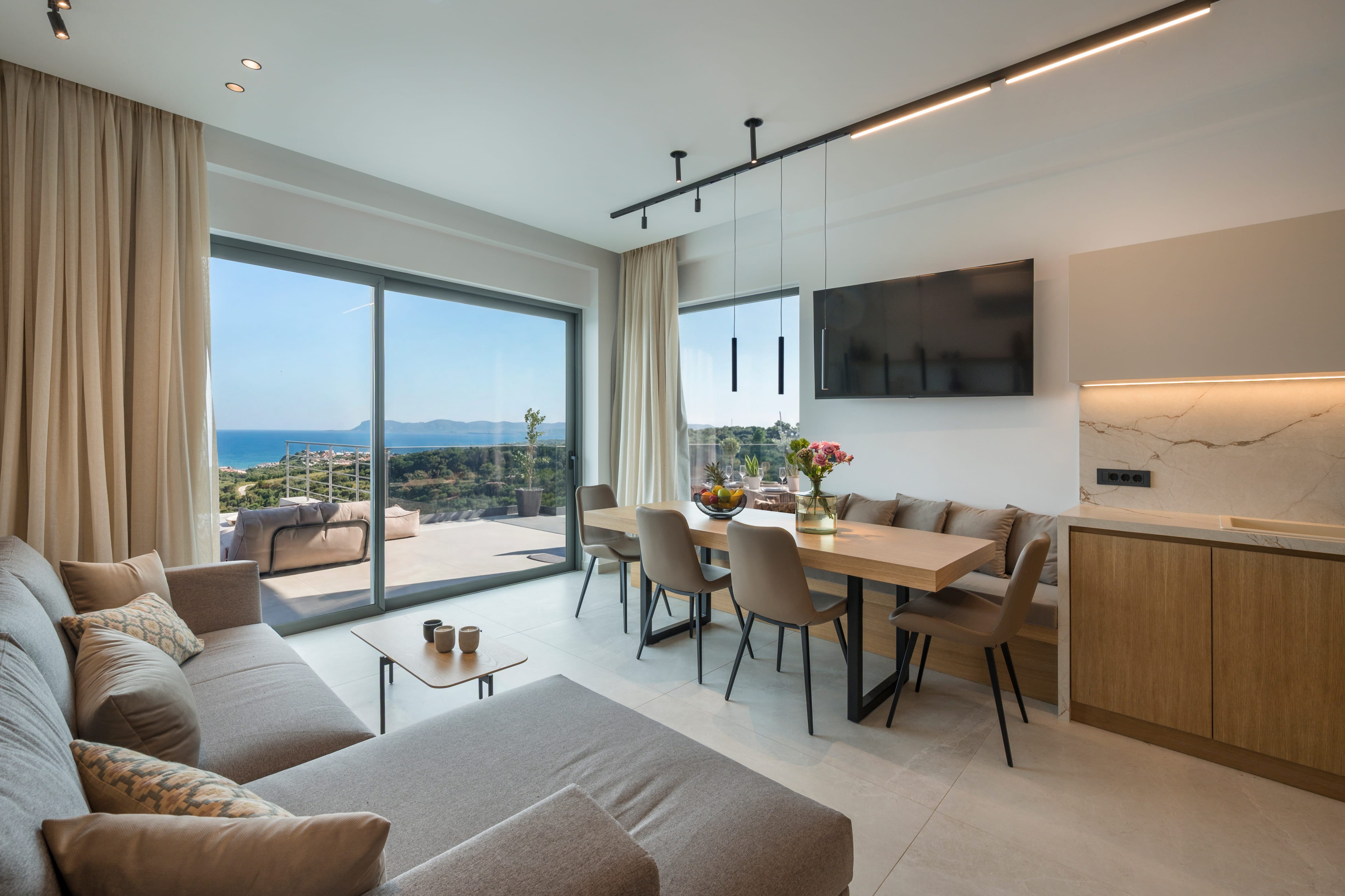 a living room with a table and chairs