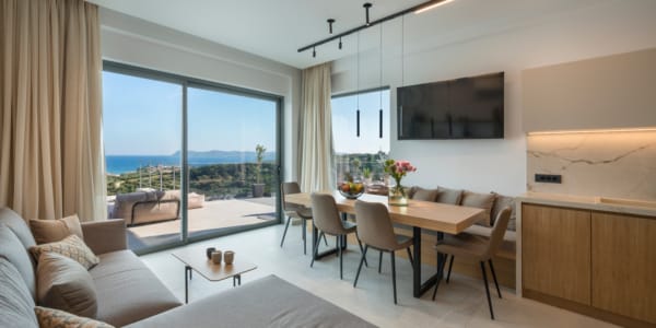 a living room with a table and chairs