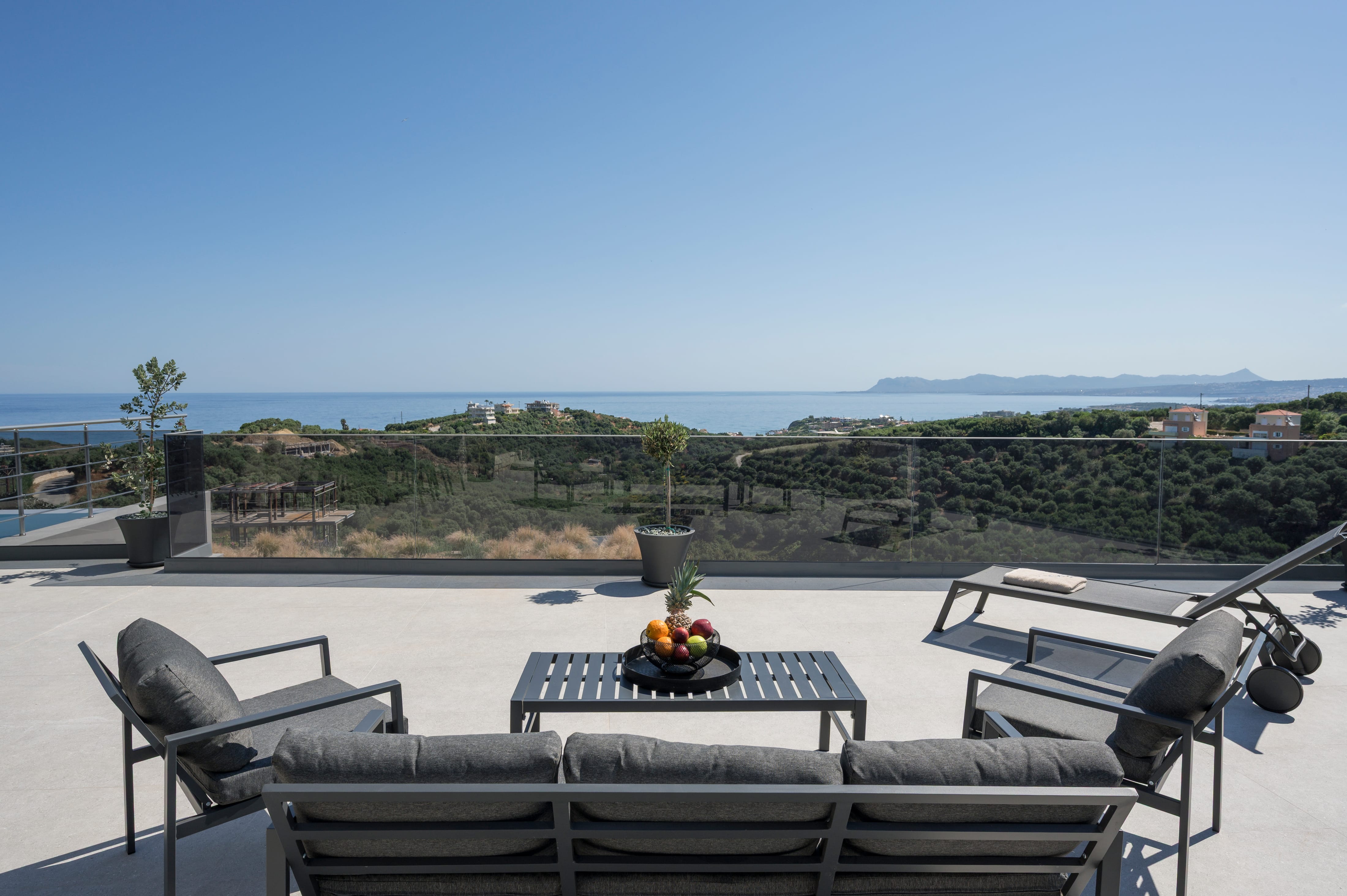 a patio with chairs and a table