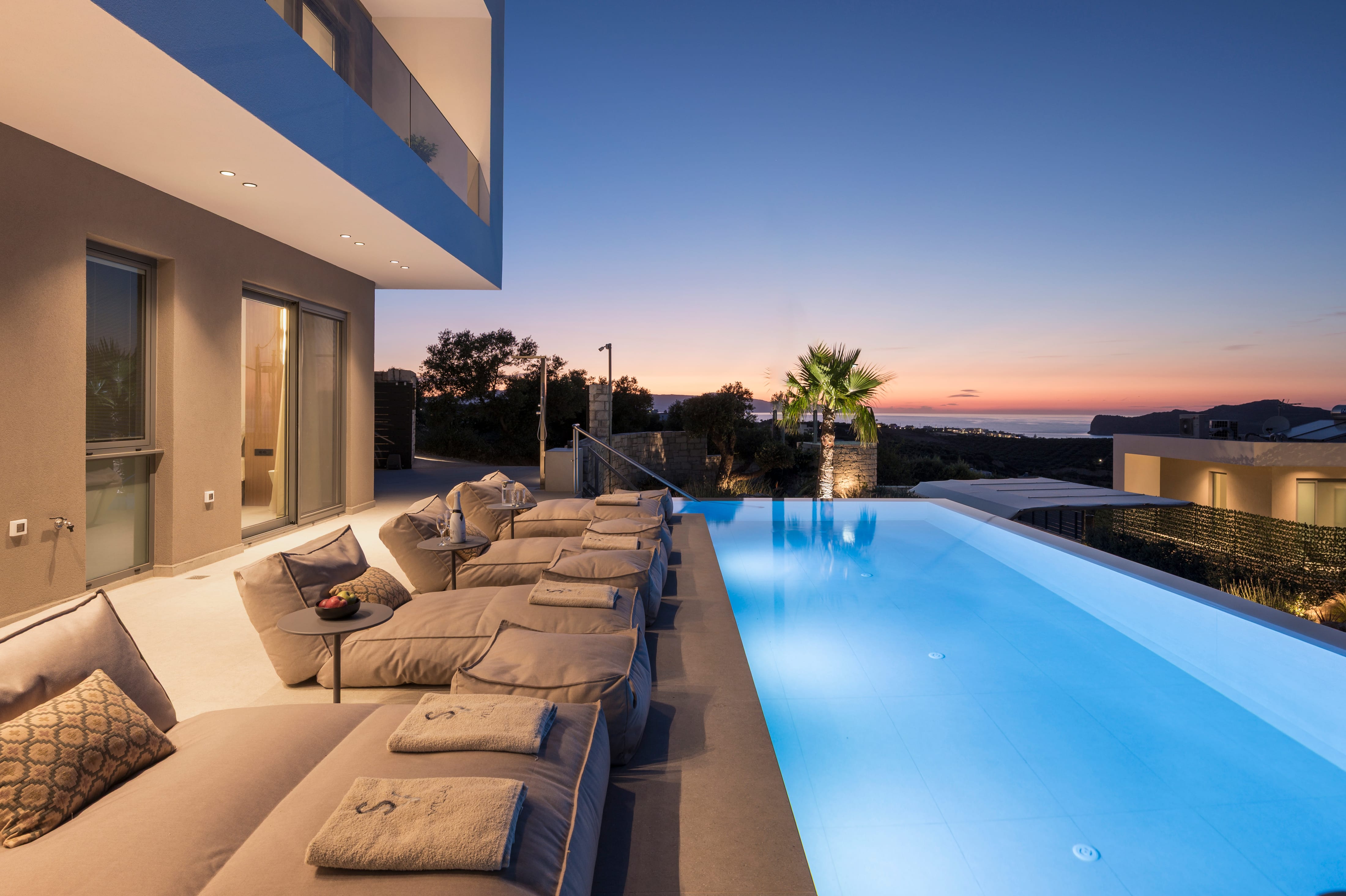 a pool with lounge chairs and a deck