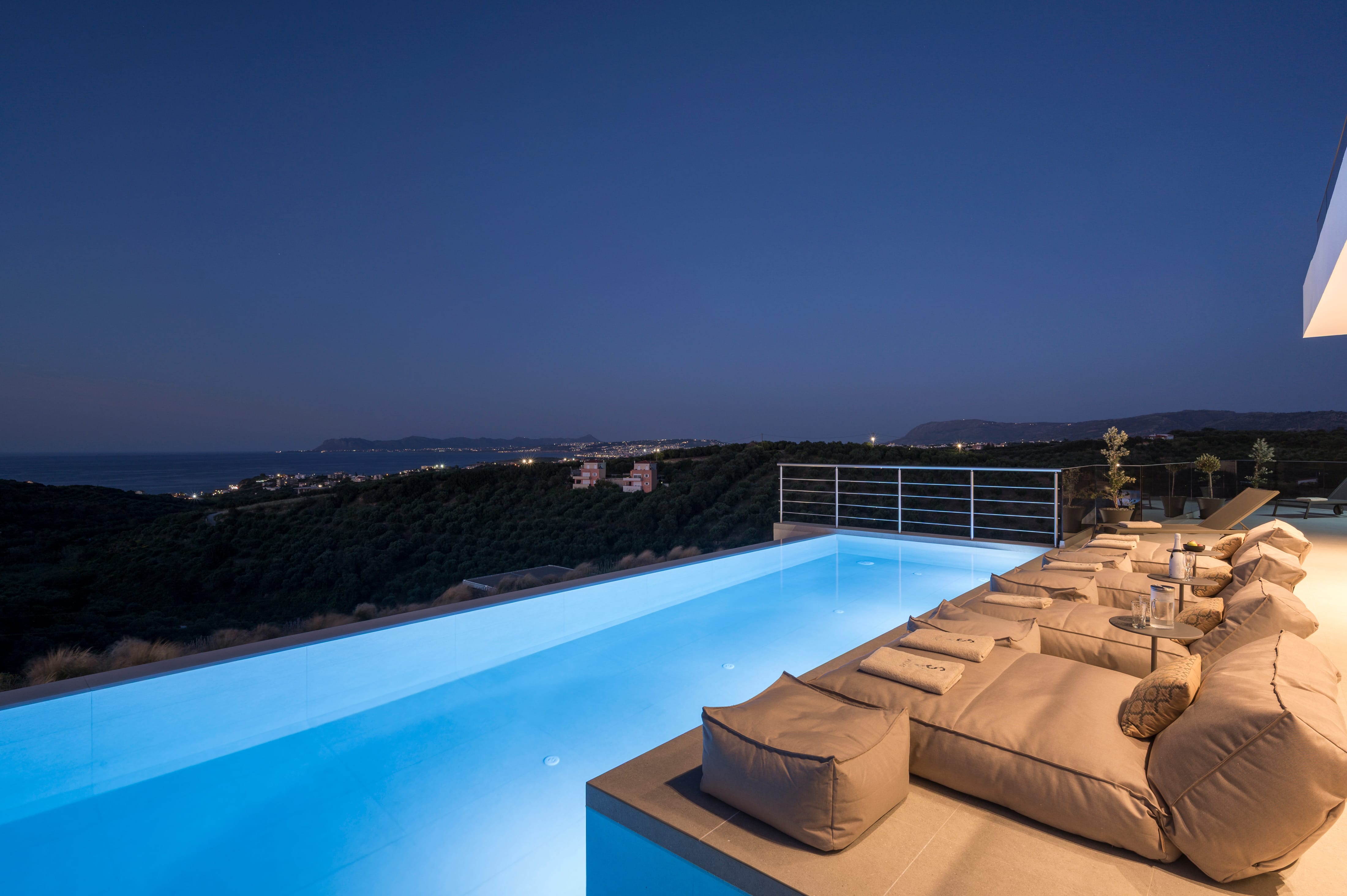 a pool with a deck and chairs