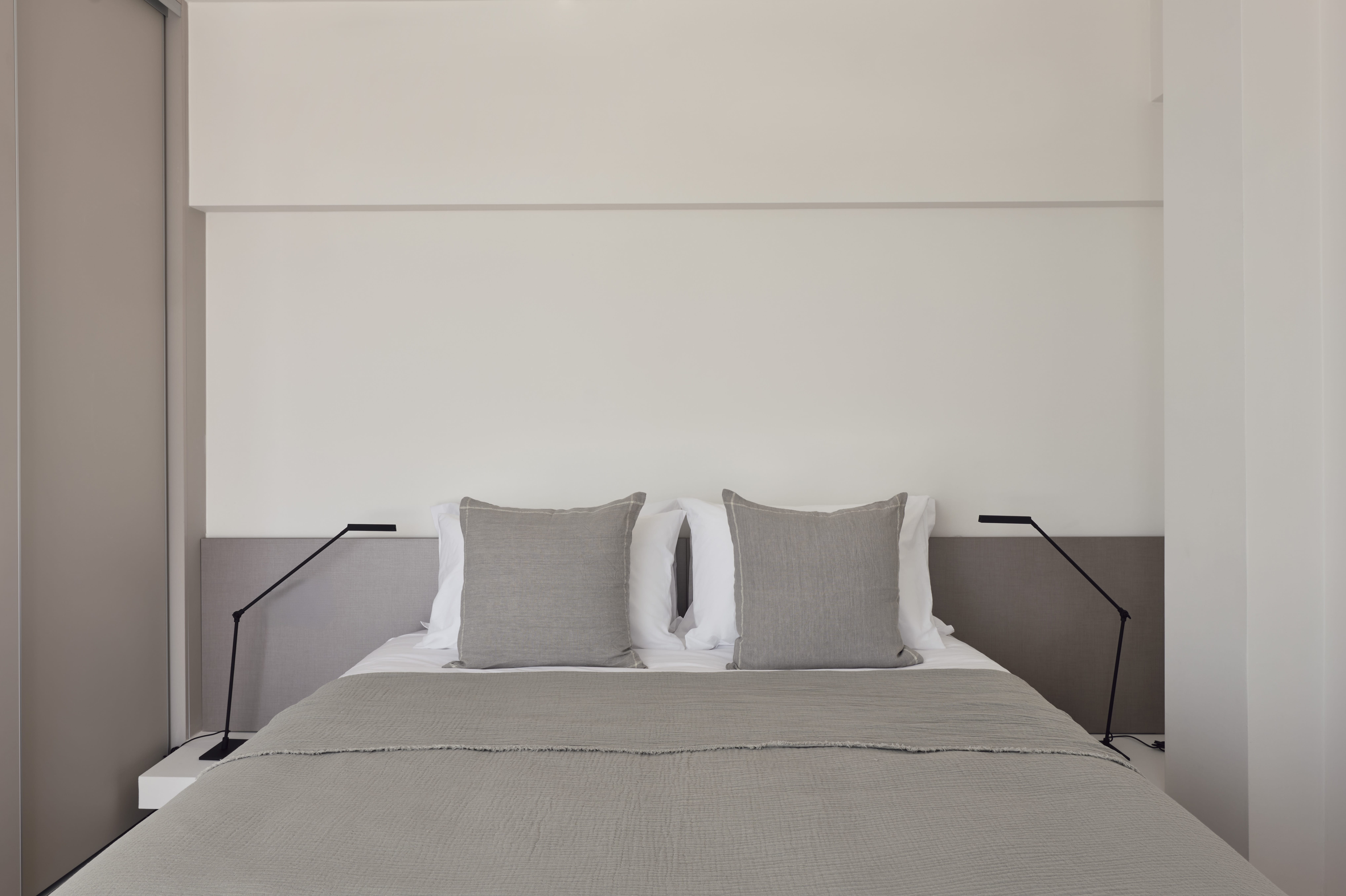 a bed with white pillows