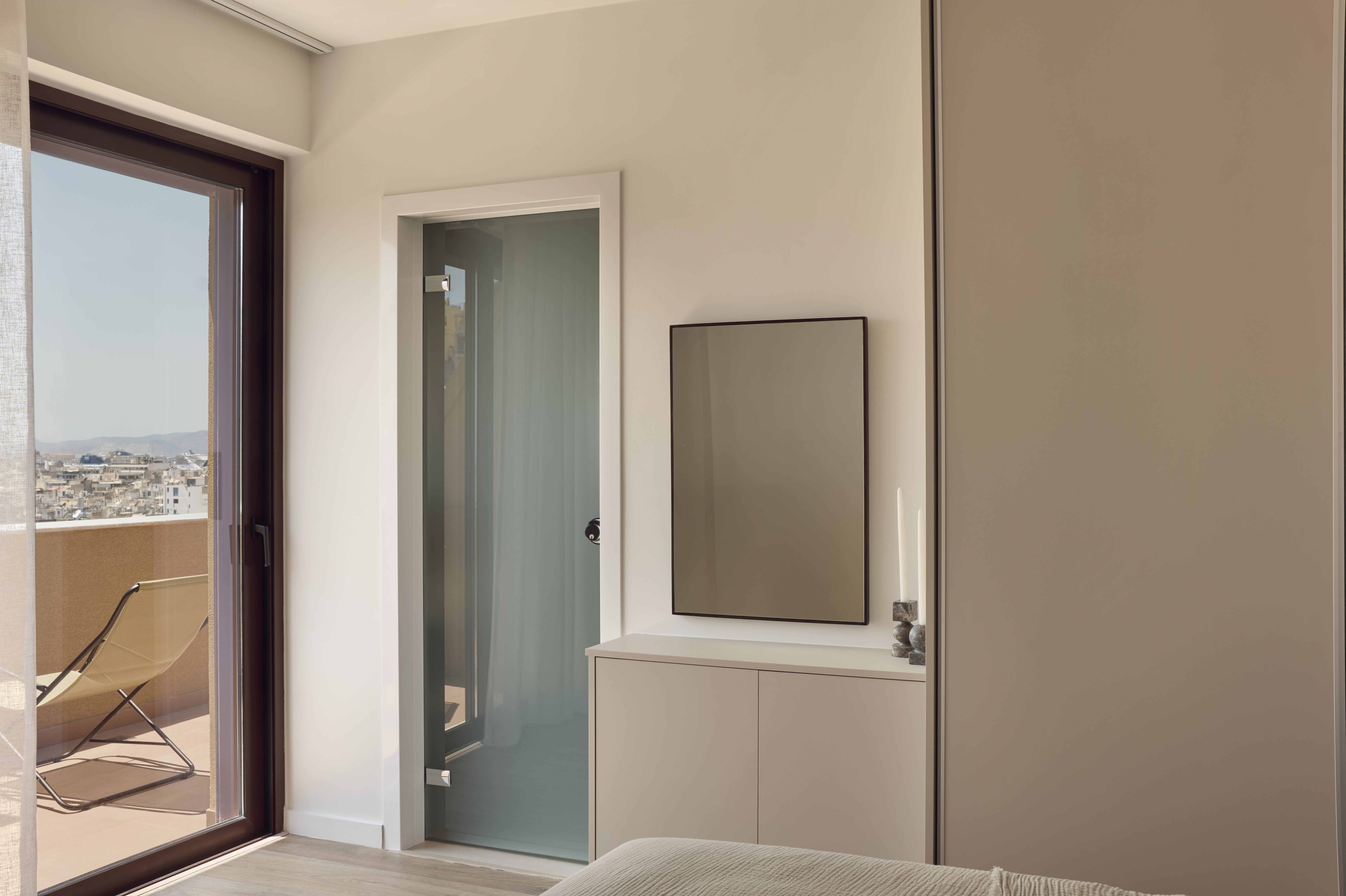 a bathroom with a glass door