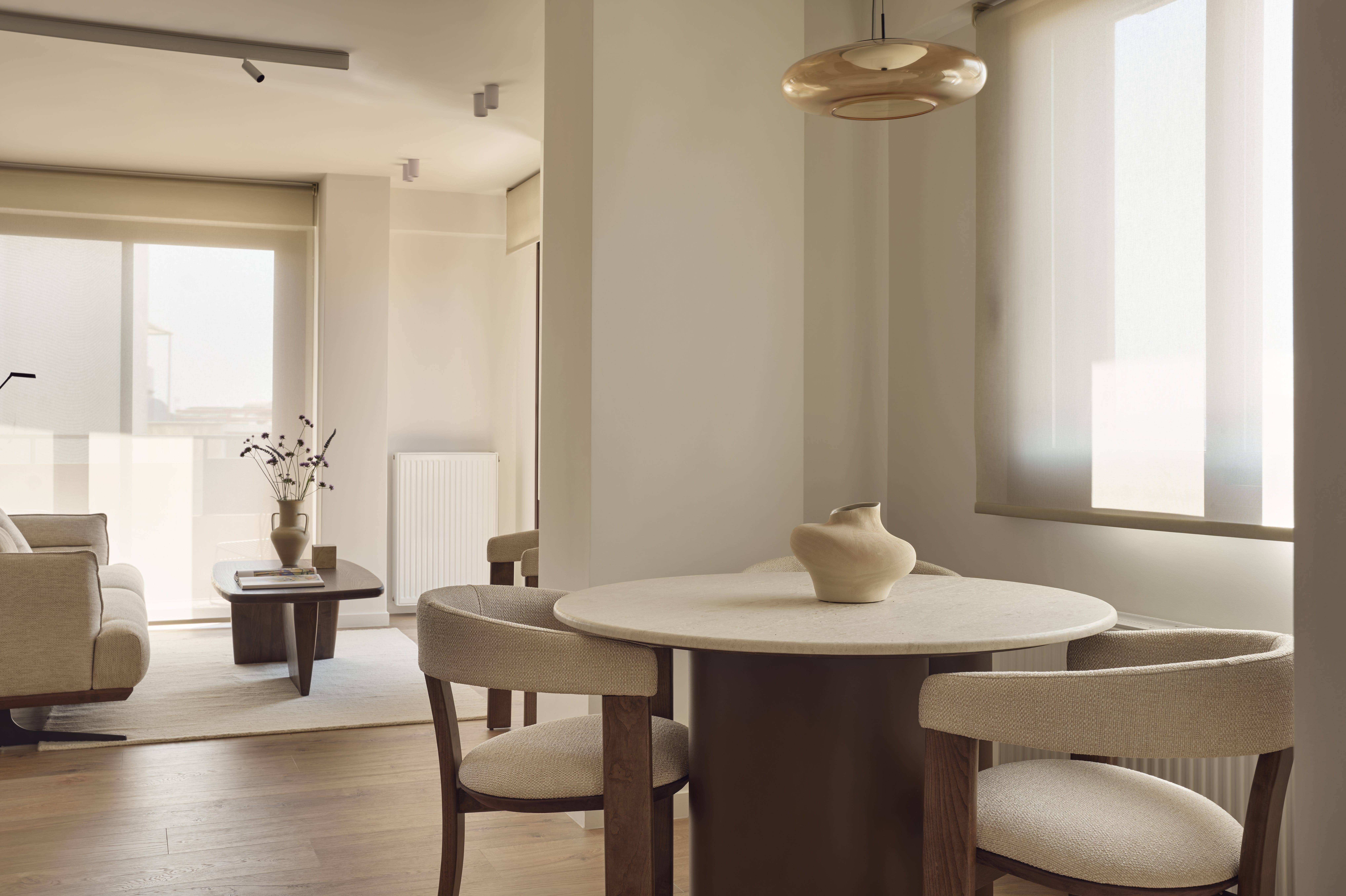 a room with a table and chairs